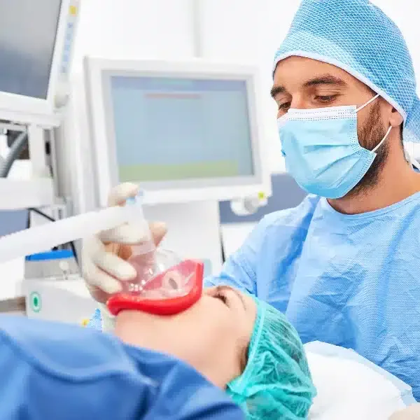 Anesthesiologist administering anesthesia before a procedure