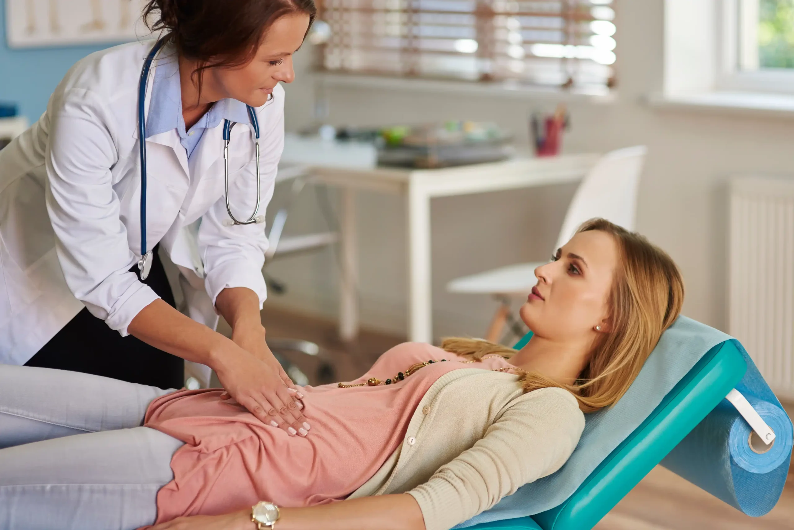 Gastroenterologist examining a patient during a consultation
