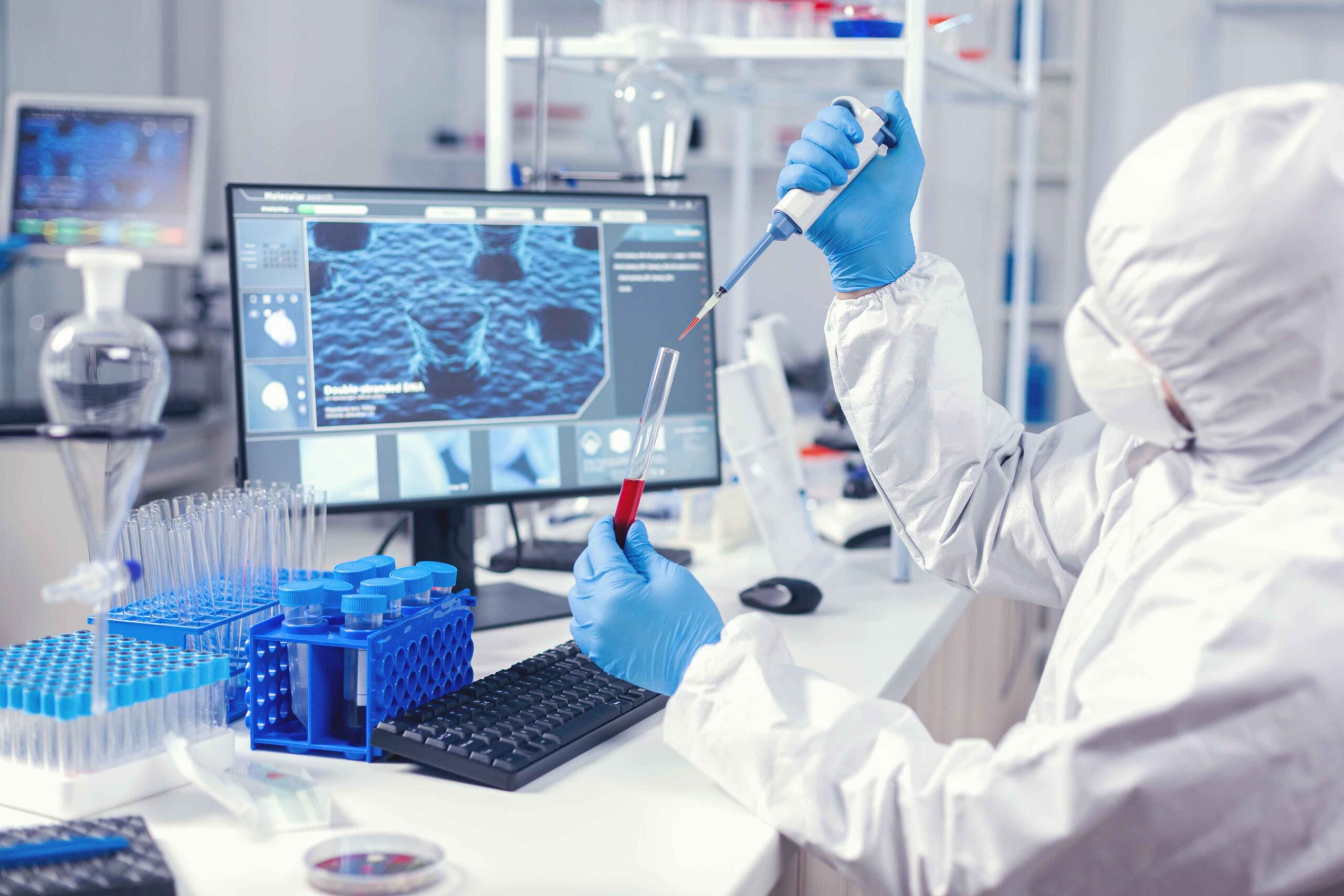 Laboratory scientist processing samples in a molecular pathology cleanroom
