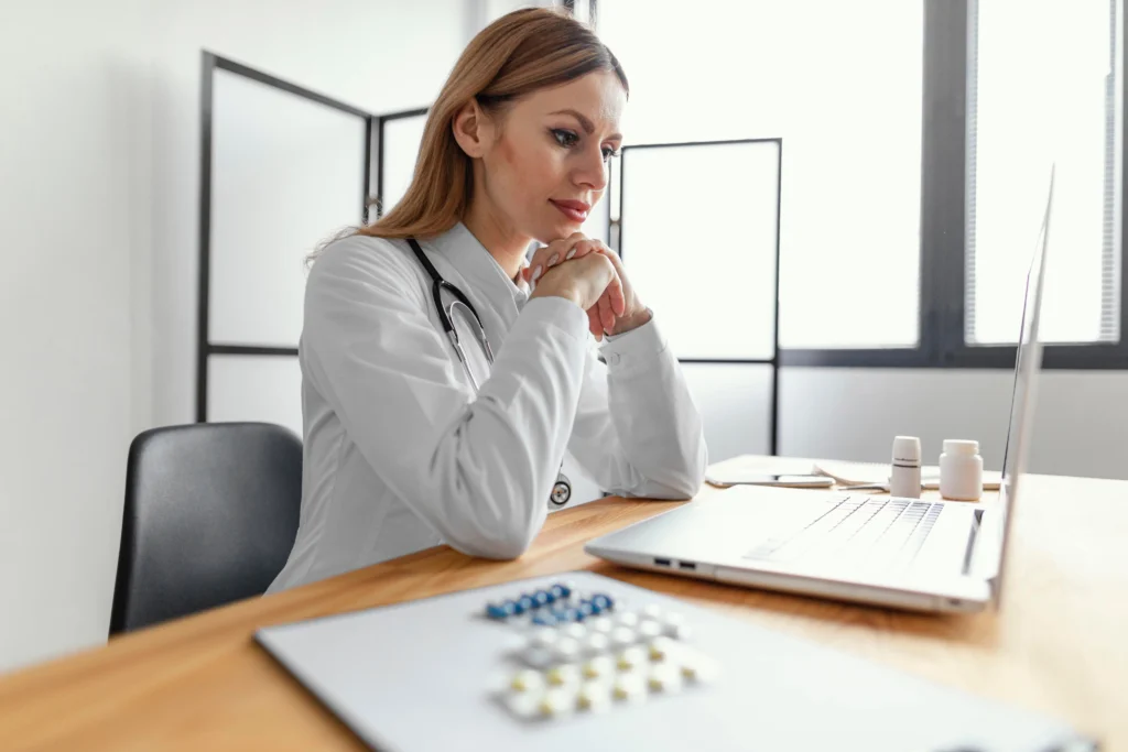 Radiologist reviewing medical necessity documentation at a desk