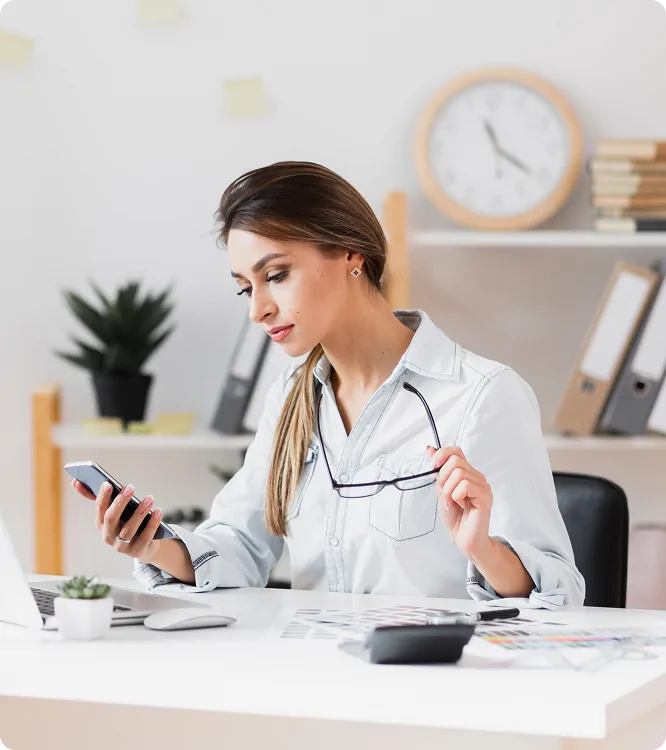 Practice biller reconciling charges with a calculator and patient files