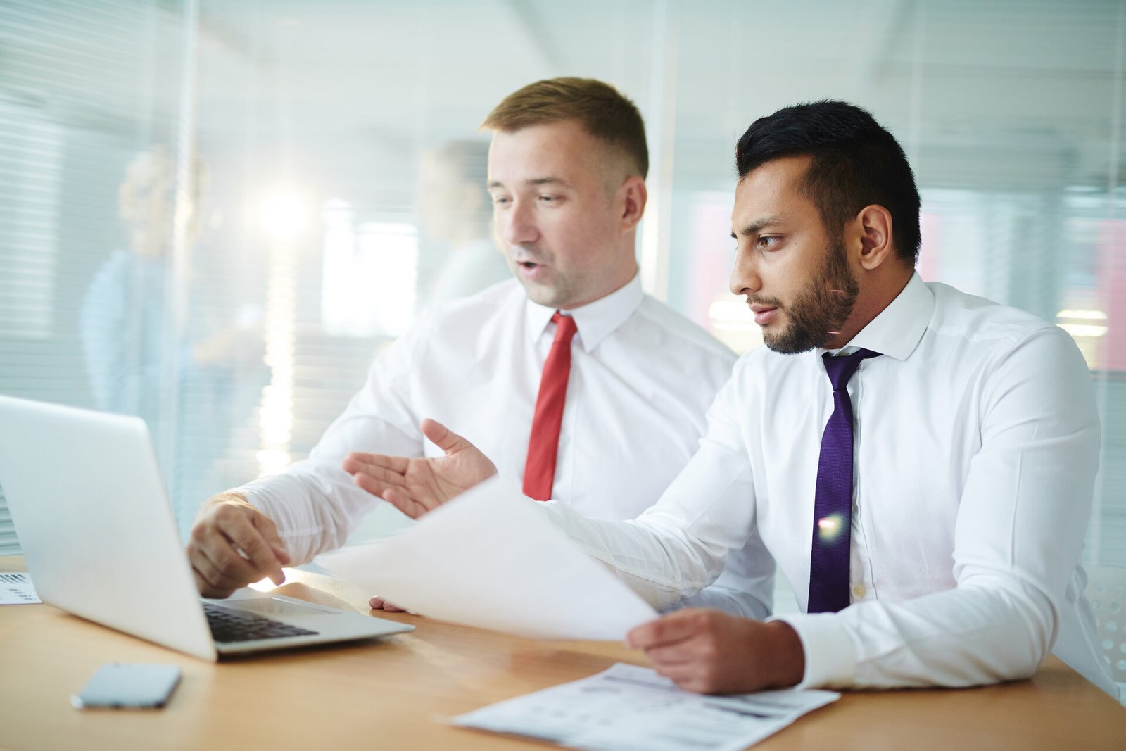 Two partners reviewing a Medivantek referral agreement together