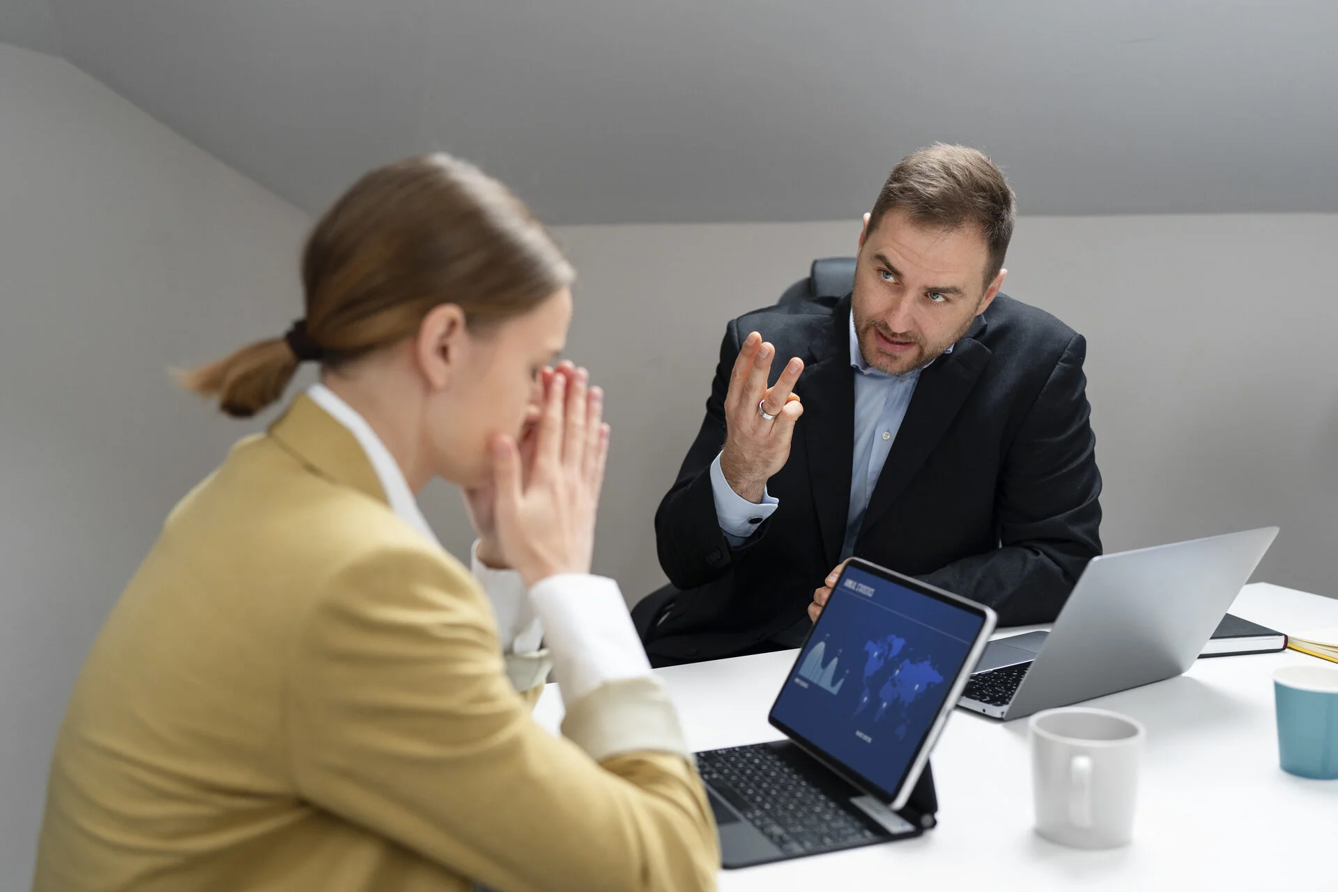 Practice manager and consultant reviewing denial data in a meeting