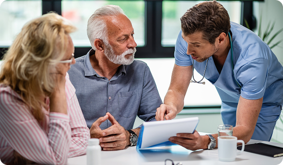 Adviser walking a couple through their insurance coverage