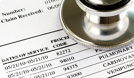 A claim form listing CPT codes and dates of service beside a stethoscope