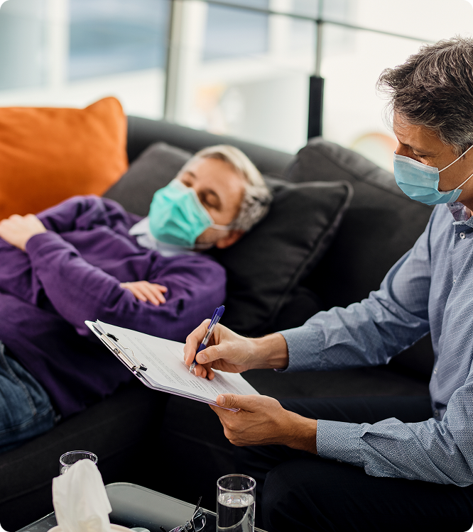 Mental health provider completing an assessment with a patient at home