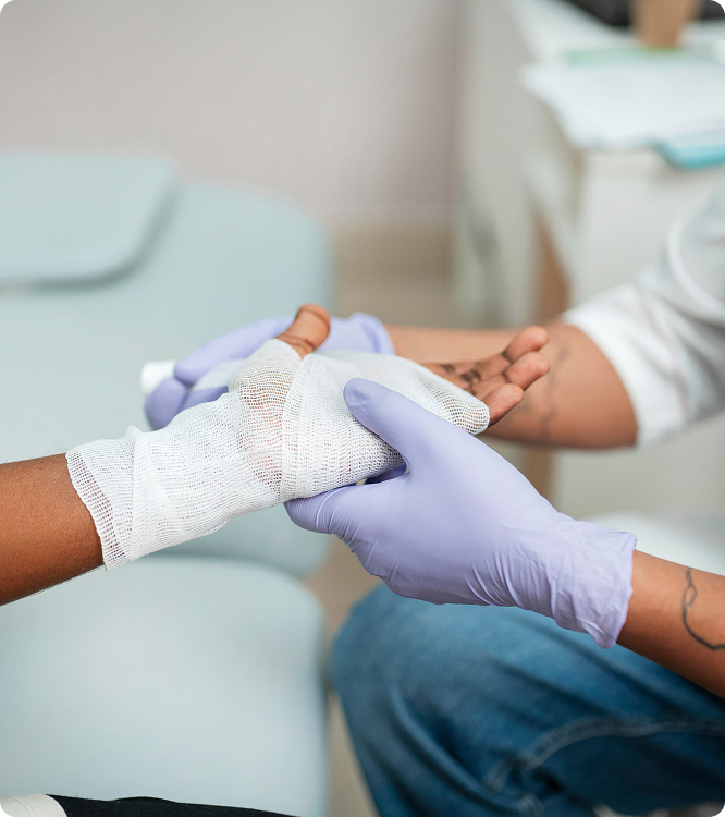 Clinician applying a dressing during a wound care treatment
