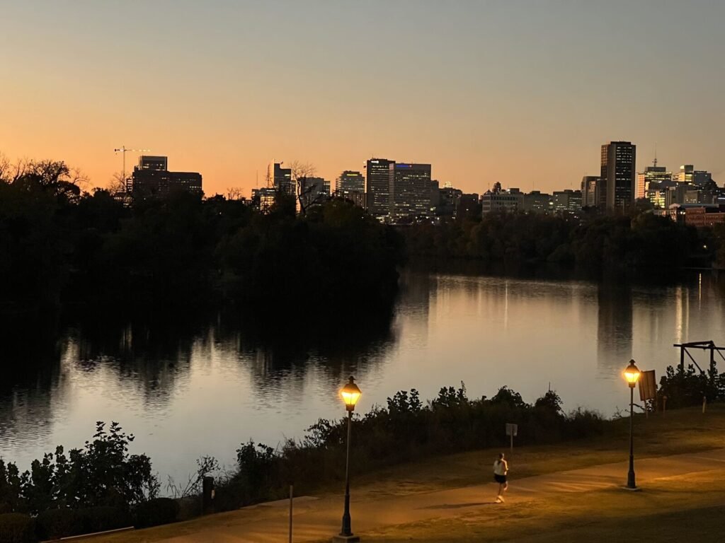 The Richmond skyline above the James River at dusk